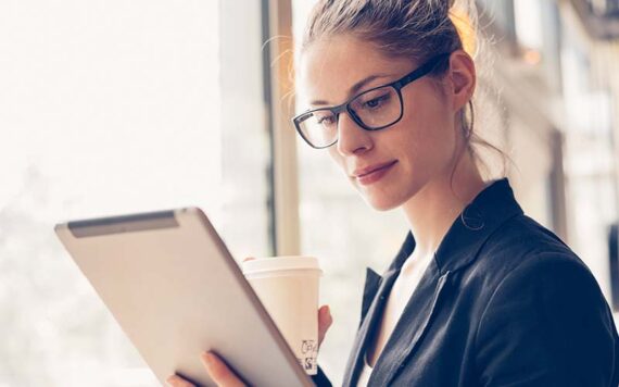 A woman reading from a tablet